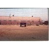 The Quonset hut in the background was our Dental Clinic, the assembly (our piss tube) in the foreground is a sunken rocket pod surrounded on 3-sides by plywood shielding.